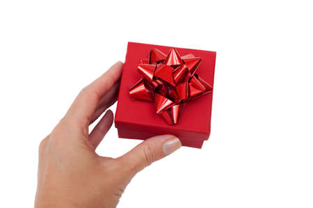 red gift box in hand on white backgroundの写真素材