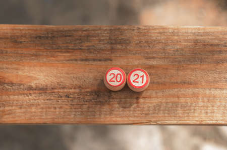 two kegs with numbers 20 and 21 stand on a wooden baseの写真素材