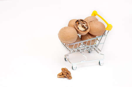walnuts in a cart on a white backgroundの写真素材