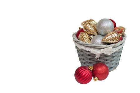 Christmas decorations in a basket on a white backgroundの写真素材