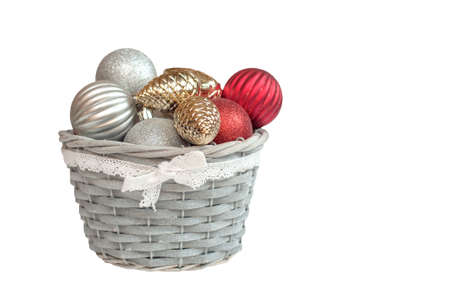 Christmas decorations in a basket on a white backgroundの写真素材