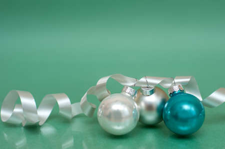 Christmas Decorations Green Background Three Ballsの写真素材