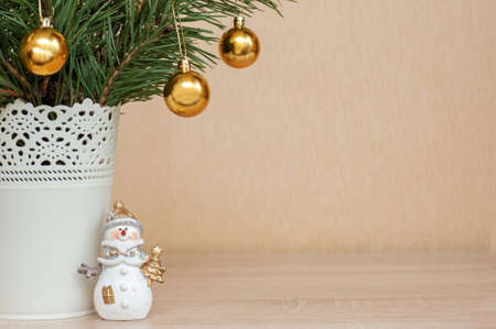 Christmas decor on the table, Christmas tree, snowman. Free spaceの写真素材