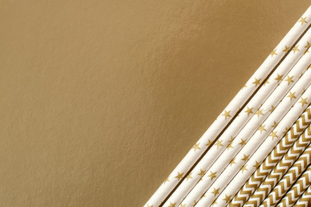 Birthday cocktail rolls on gold background.の写真素材