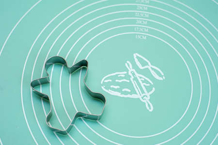 Man-shaped cookie cutter on a silicone matの写真素材