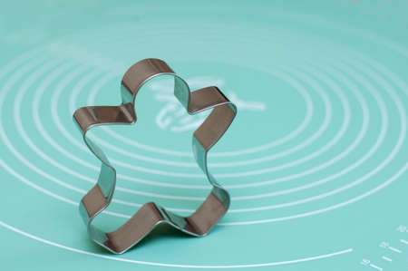Man-shaped cookie cutter on a silicone matの写真素材