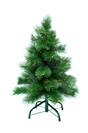 Artificial Christmas tree on a stand on a white backgroundの写真素材