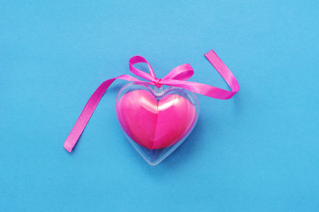 Heart made of sponges on a blue backgroundの写真素材