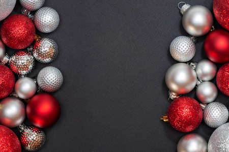 Christmas composition of silver and red balls. Flat lay, top view, copy spaceの写真素材