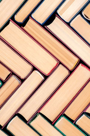 Old hardback books, vertical photo.の写真素材