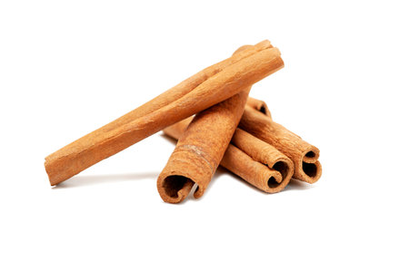 Fragrant cinnamon sticks isolated on white backgroundの写真素材