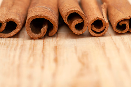 Close-up cinnamon sticks on a wooden table.Copy spaceの写真素材
