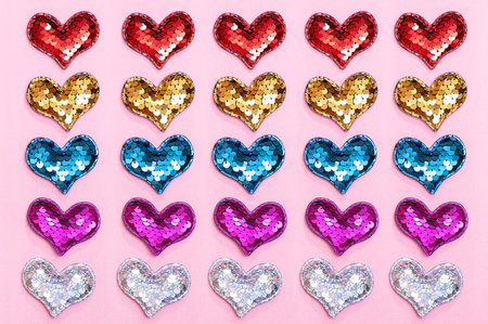 Multicolored hearts on a pink surface. Festive background for Valentine's Day. love concept.