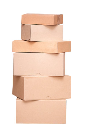 Stack of brown cardboard boxes isolated on white backgroundの写真素材