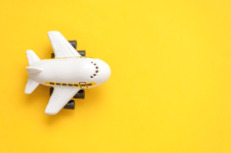 Airplane model on a yellow backgroundの写真素材