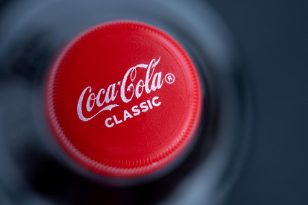Smolensk, Russia - October 20, 2023: Coca-Cola plastic cap close-up on a black background.のeditorial素材