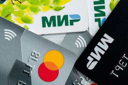 Smolensk, Russia - October 20, 2023: Different plastic cards close-up, Mir and Master Card financial systems.のeditorial素材