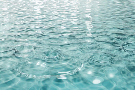 White aqua texture, surface of ripples, rings, transparen and sunlight. Spa concept background. Flat lay, top view, copy spaceの素材