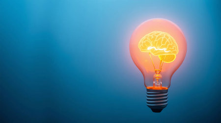 Idea concept with human brain inside light bulb on blue background.の素材