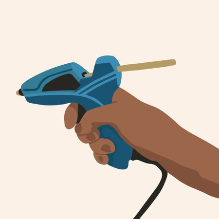 Vector isolated illustration of a hand holding a glue gun.のイラスト素材