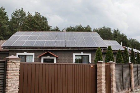 Big modern house with solar panels. Alternative energy. Sun power. Ecology concept