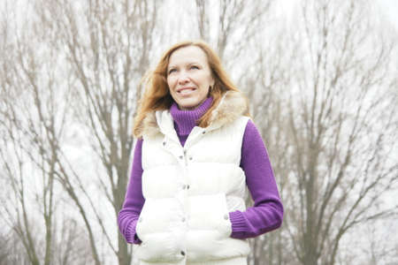 Mature blonde fit woman walking outdoorsの写真素材