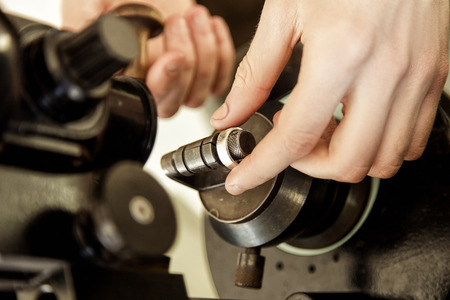 The process of creating and polishing the ring close-up. Handmade. Work in the workshop with toolsの写真素材