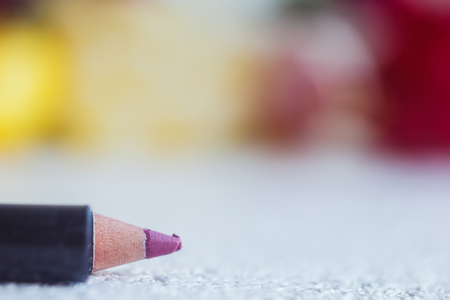 cosmetic pencil for applying makeup on the face close-up. eye liner in macro on blurred background.の写真素材