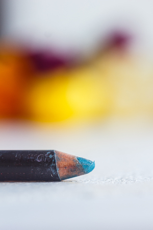 cosmetic pencil for applying makeup on the face close-up. eye liner in macro on blurred background.の写真素材