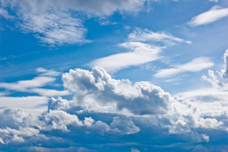 white cumulus clouds in the form of cotton wool on a blue sky. background, bright sky texture.