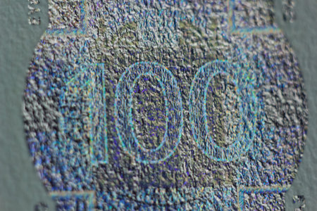 Protective watermark on a hundred euro bill in macro. protection against counterfeiting of...