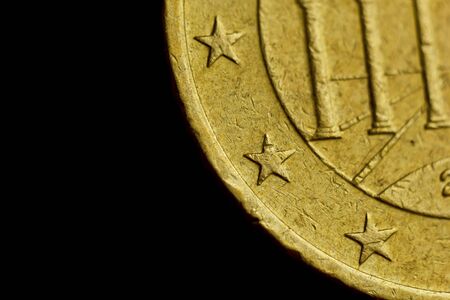 Reverse side of the coin fifty euro cent macro isolated on black background. Detail of metallic money close up. EU money.の写真素材