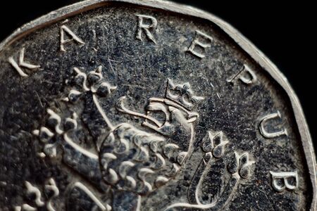 Coin two Czech koruna macro isolated on black background. Detail of metallic money close up. European country money Czech Republic.の写真素材