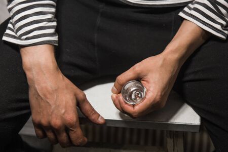 male alcoholism. drinking father, a man drinks vodka. feeling unwell. assault, booze at home. stop alcohol.の写真素材