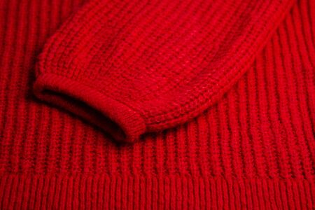 Pattern of colorful knitted sweaters closeup. Handmade merino wool product. Knitting patternsの写真素材