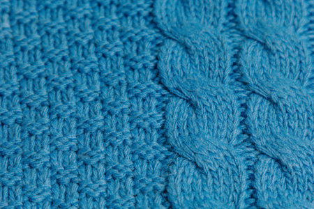 Pattern of colorful knitted sweaters closeup. Handmade merino wool product. Knitting patterns