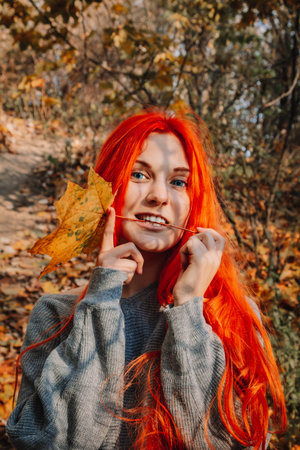 Sexy beautiful redhead girl with long, strong and thick hair. Perfect woman portrait on a background...