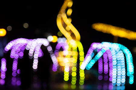 Golden abstract yellow, orange bokeh lights isolated on black background with copy space. Holiday...