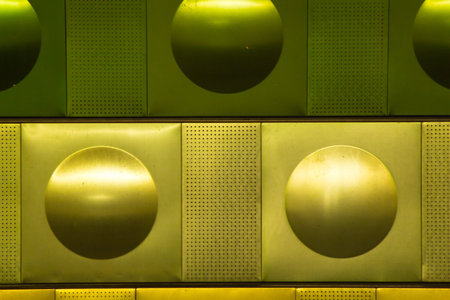 Metal decorations on the wall of Prague metro station. Background for advertising, announcements and...