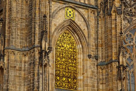 Prague. 05.10.019: The Metropolitan Cathedral of St. Vitus, Wenceslas and Adalbert is a Roman Catholic cathedral with spectacular medieval stained glass windowsの写真素材
