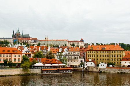 Prague. 05.10.2019: Orange colored roof tops of Prague old town buildings and baroque style houses...
