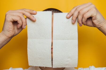 Toilet paper purchase due to kronavirus concept. Personal hygiene and stopping the spread of the virus. Cleanliness, Hygiene, Sterility. Copy spaceの写真素材