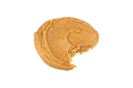 Smears of delicious peanut butter on a white background. isolated image