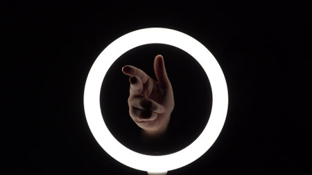 gesture package. female hands close-up make figures from fingers. fingerplay. finger pistol imitation. palm gun.の写真素材