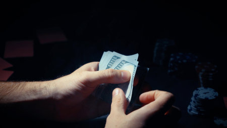 The winner of the poker game counts the money won in the tournament. card gamblingの写真素材