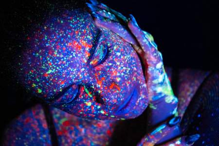 Model woman in neon light, beautiful model girl with fluorescent makeup, art design of disco dancer dancing in uv light, colorful makeup. nightclub, partyの写真素材