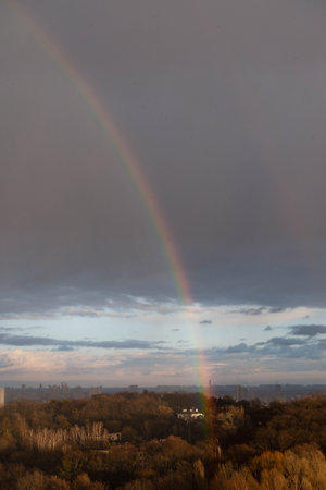 Double rainbow against the sunset sky. Leprechaun at the end of the rainbow. Rainbow as a concept of fantastic money. Pot of gold. St.Patrick's Dayの写真素材