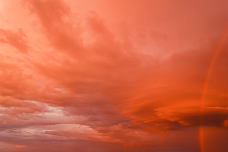 Beautiful luxury soft gradient orange gold clouds and rainbow on sky perfect for background, rainbow colors as a lgbtq symbolの写真素材
