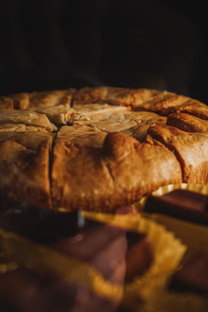 Chicken pie front view close up. Display case with a variety of cakes and cupcakes. Desserts at cafes and coffeeshops.の写真素材