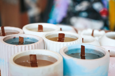 Process of making candles in a workshop. Ecological and vegan business. Set of aroma candles on a table. Made candle in the workshop.の写真素材